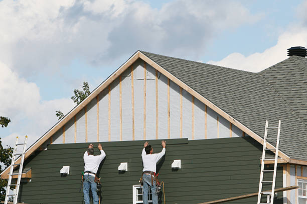 Professional Storm Damage Siding Repair technician working in Dayton, IN